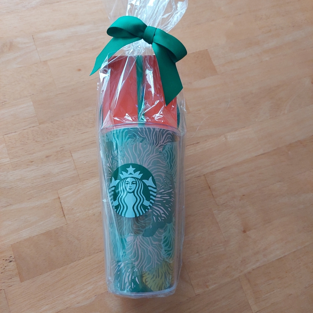 Starbucks 16 Fl Oz (473 ml) Coldbrew Travel Tumbler with Pink and Green Accents.